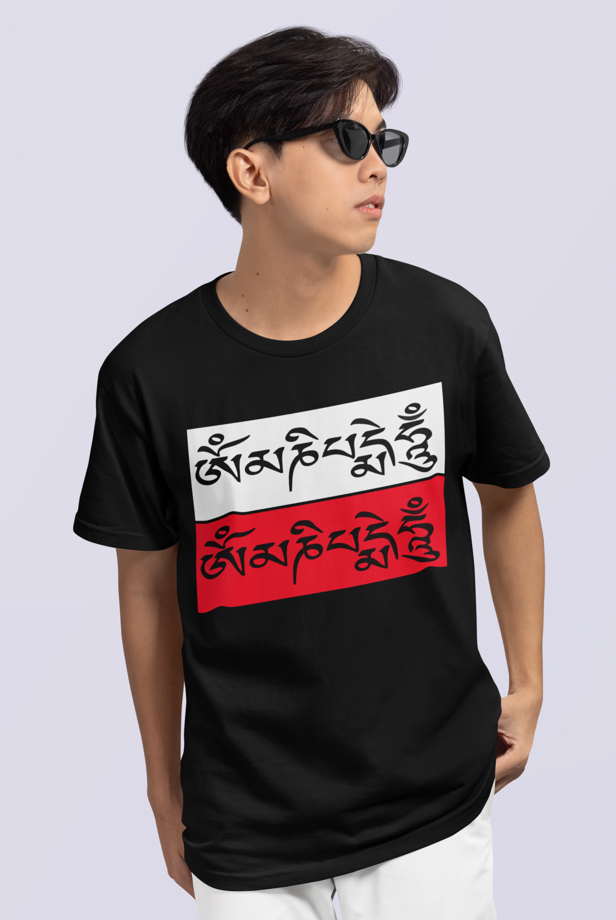 "Black t-shirt featuring a bold design of the sacred mantra 'OM Mani Padme Hum' printed in white and red. The spiritual typography stands out beautifully against the dark background, creating a striking and meaningful aesthetic."